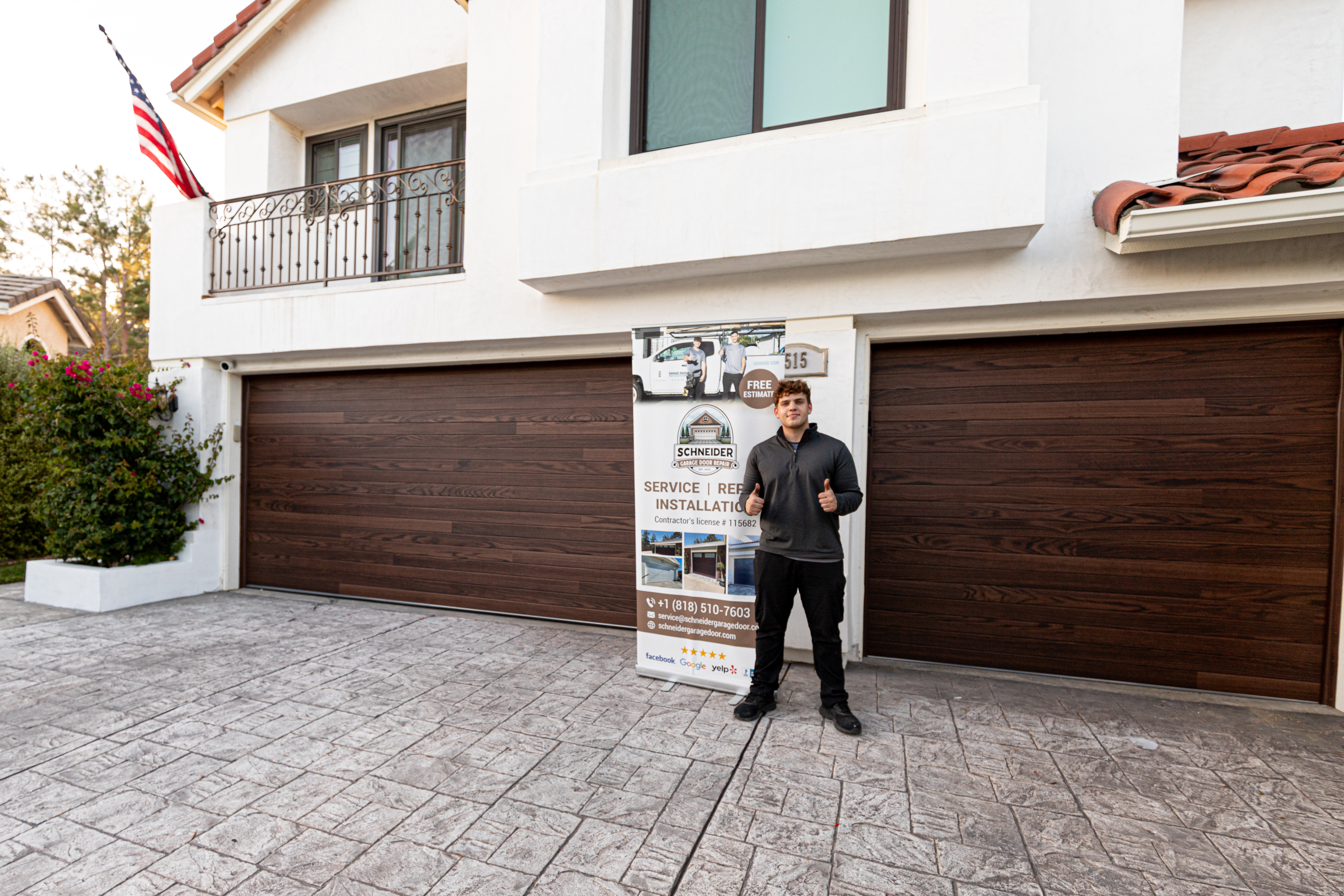 Schneider team installing a modern custom garage door