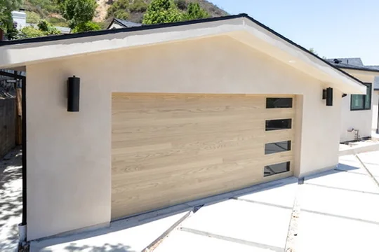Wood-look steel garage door with natural oak finish